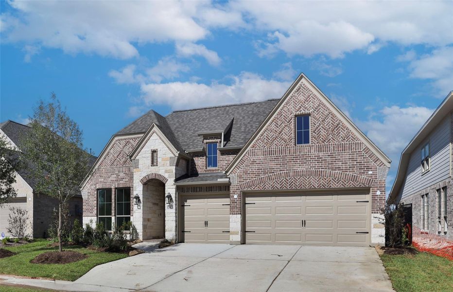 Front exterior of a new home in Marvida 55' - Gated, Cypress, TX, highlighting curb appeal (Image 11).