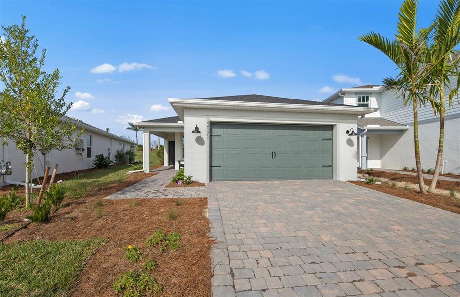 Front exterior of a home in the Reagan Landing community, located in Bradenton, FL (Image 4).