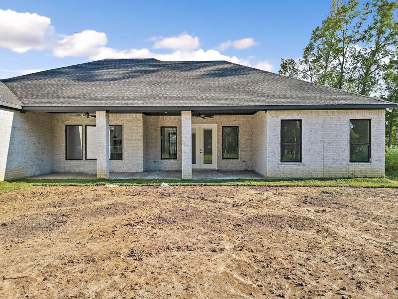 Front exterior of a new home in , Dayton, TX, highlighting curb appeal (Image 1). Front exterior of a new home in , Dayton, TX, highlighting curb appeal (Image 1).