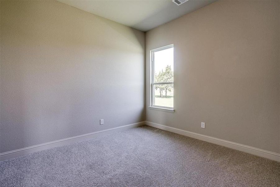 Spare room featuring carpet floors