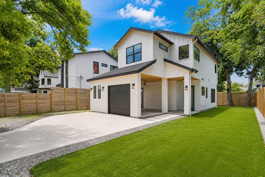 Modern architecture with a convenient attached garage and verdant green lawn.