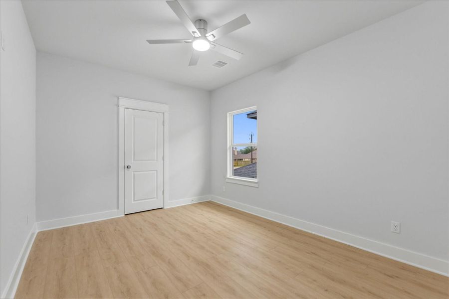 All secondary bedrooms offer ceiling fans, luxury vinyl flooring, and spacious walk-in closets.