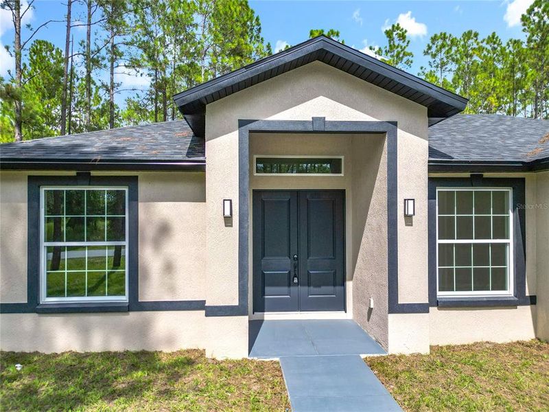 Front exterior of a new home in , Citrus Springs, FL, highlighting curb appeal (Image 2).
