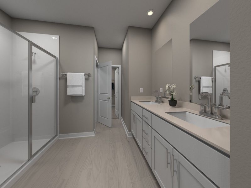 The primary bathroom offers dual vanity sinks and a walk-in shower.