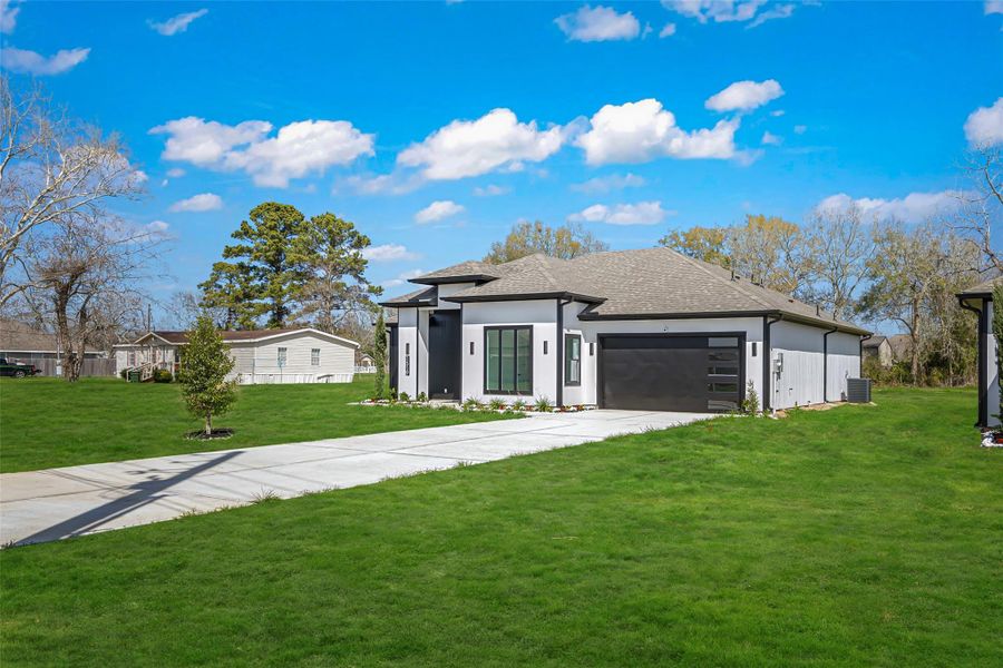 Front exterior of a new home in , Dayton, TX, highlighting curb appeal (Image 22).