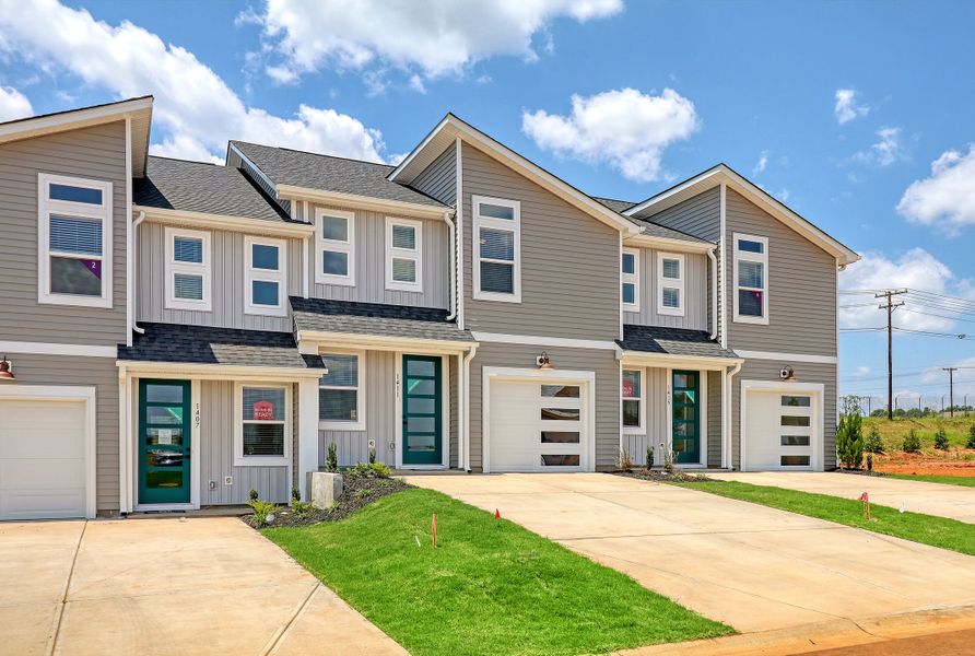 Representative exterior photo of a completed home built from the Ivey by Hunter Quinn Homes in Westgate Village Townes, Spartanburg, SC (Image 21). Representative exterior photo of a completed home built from the Ivey by Hunter Quinn Homes in Westgate Village Townes, Spartanburg, SC (Image 21).