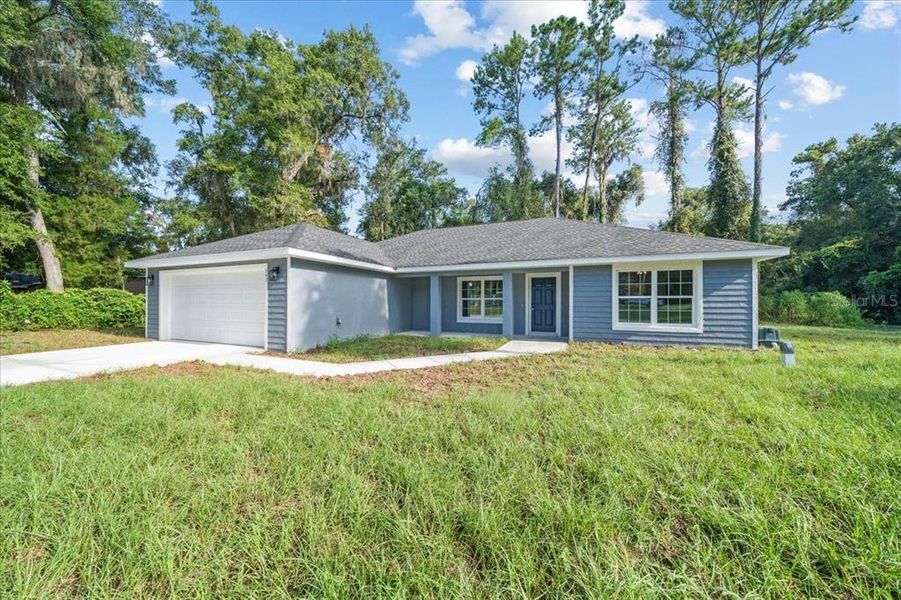 Front exterior of a new home in , Dunnellon, FL, highlighting curb appeal (Image 21).