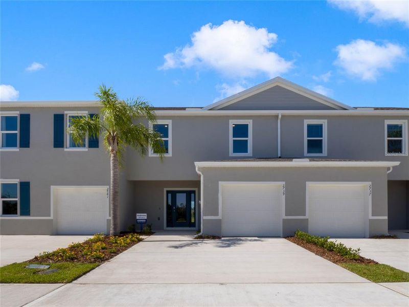 Front exterior of a new home in Rivers Edge, Edgewater, FL, highlighting curb appeal (Image 1). Front exterior of a new home in Rivers Edge, Edgewater, FL, highlighting curb appeal (Image 1).