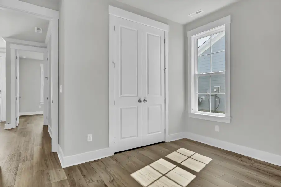 Spacious, unfurnished interior of a new home in Grand Park, Leland (Image 16). Spacious, unfurnished interior of a new home in Grand Park, Leland (Image 16).