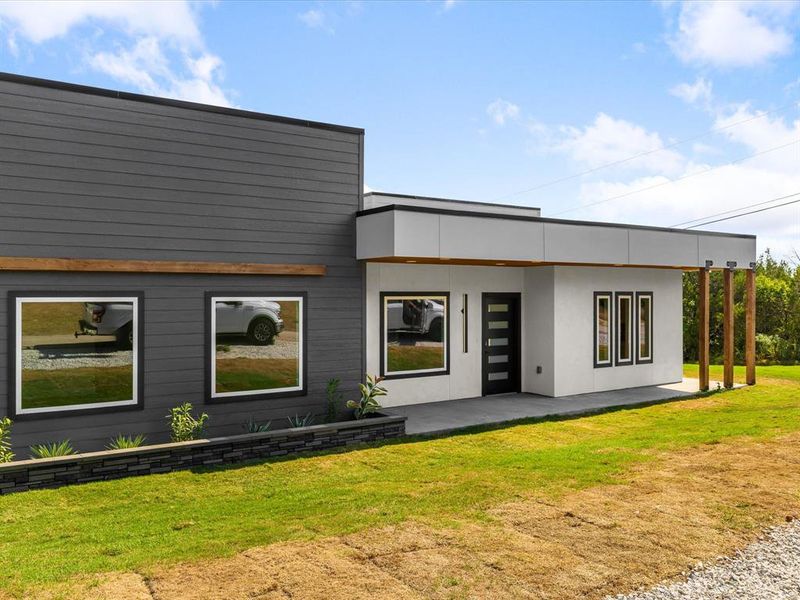 Front exterior of a new home in , Granbury, TX, highlighting curb appeal (Image 15). Front exterior of a new home in , Granbury, TX, highlighting curb appeal (Image 15).