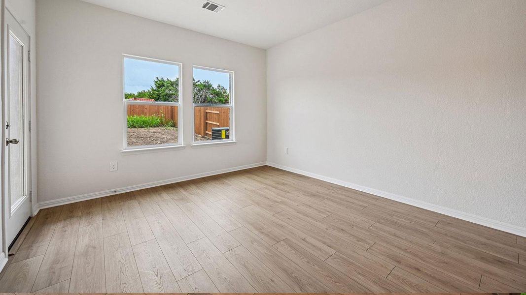 Spacious, unfurnished interior of a new home in Bar W Ranch, Leander (Image 28).
