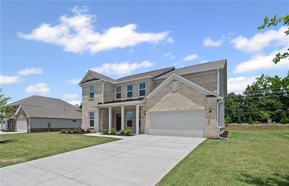 Front exterior of a new home in Anderson Point Estates, McDonough, GA, highlighting curb appeal (Image 1).