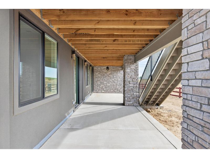 Exterior details and patio area of a home in RainDance, Windsor (Image 31).