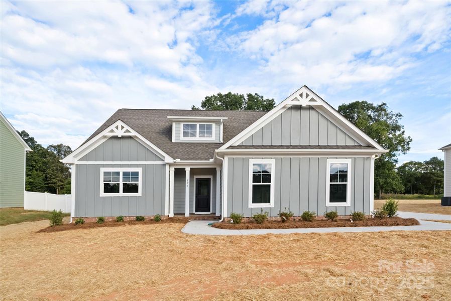 Front exterior of a new home in , Monroe, NC, highlighting curb appeal (Image 1).