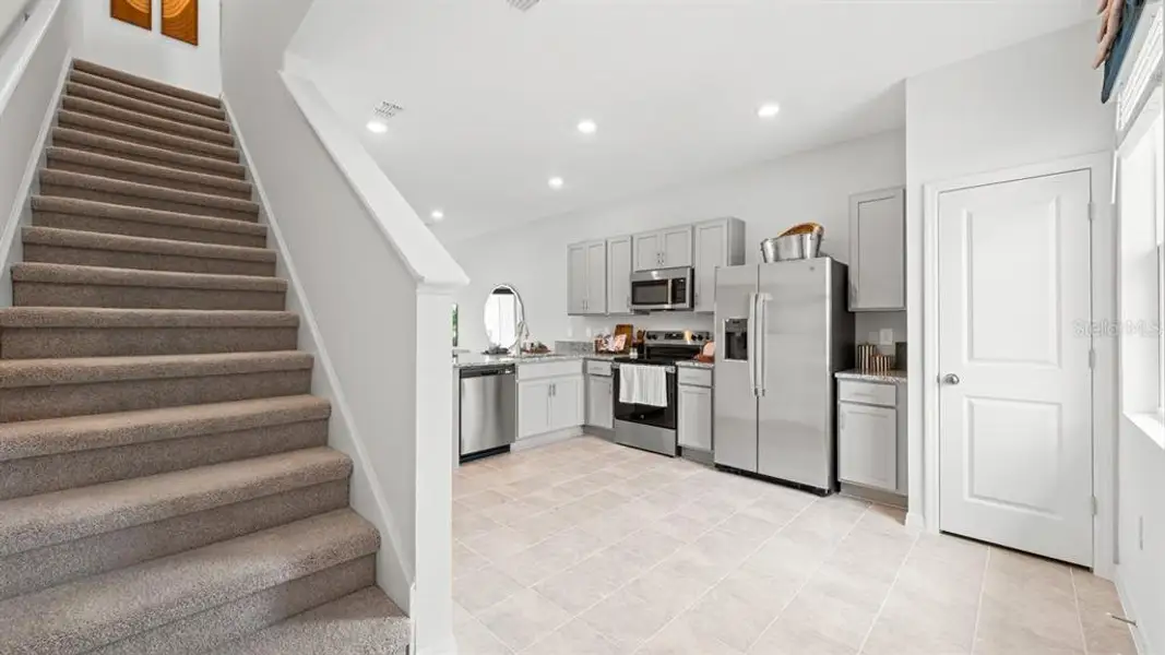 Furnished interior view inside a new home in Westview Community Group Page, Kissimmee (Image 8).