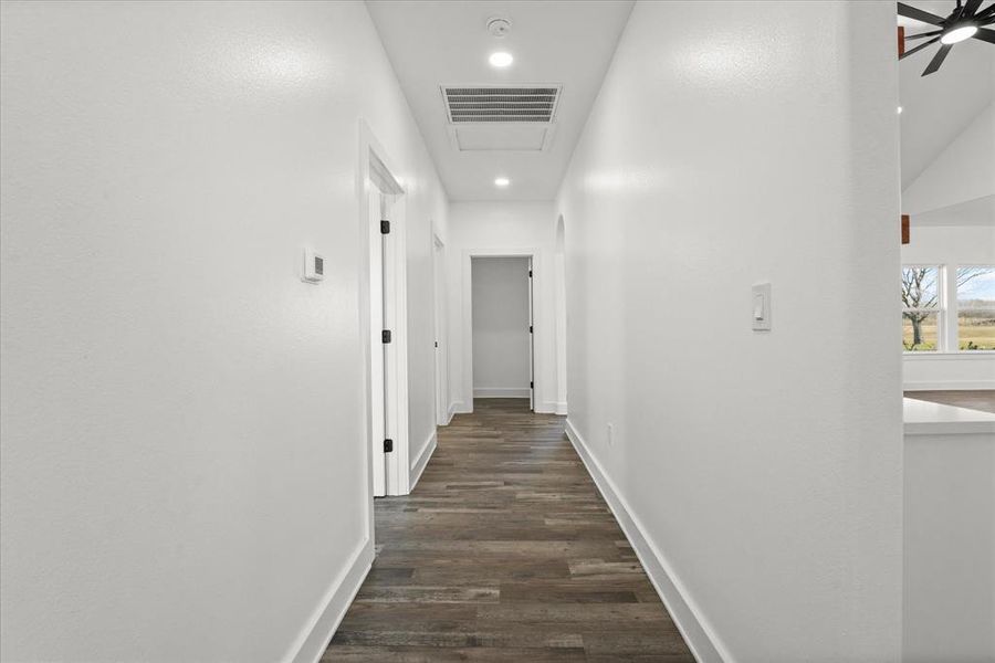 Corridor featuring dark hardwood / wood-style floors