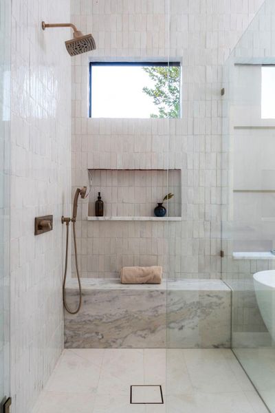 Bathroom featuring walk in shower