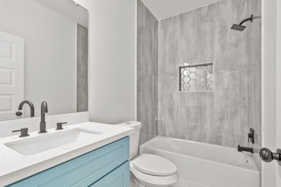 Custom tiled shower in the guest bathroom. Custom tiled shower in the guest bathroom.