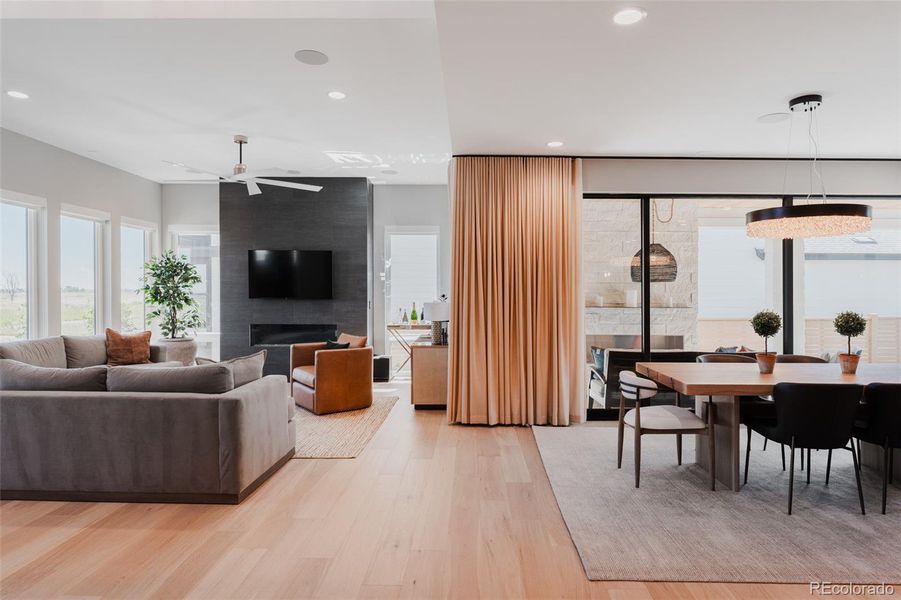 Contemporary finishes and lighting amplify the soul of the home where illustrations of contrast like black clad doors and bright white walls add depth while light wood floors throughout the home introduce a warm organic element.