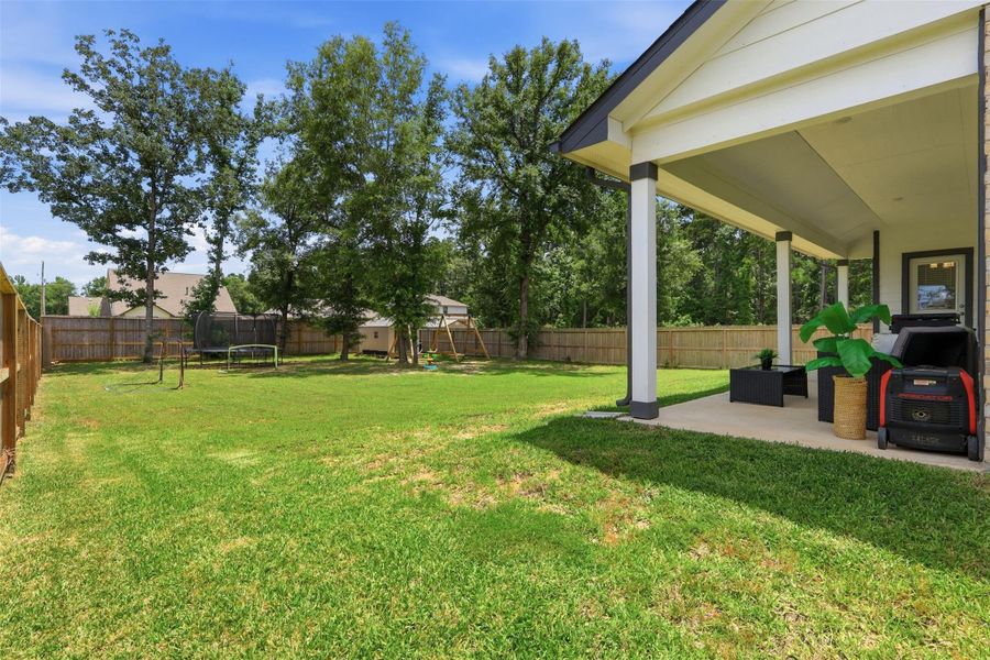 Exterior details and patio area of a home in Deer Trail Estates, Conroe (Image 3).