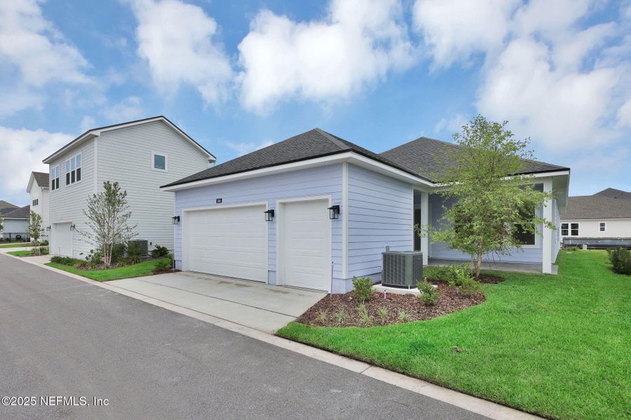 Front exterior of a new home in Seabrook Village at Seabrook, Nocatee, FL, highlighting curb appeal (Image 1).