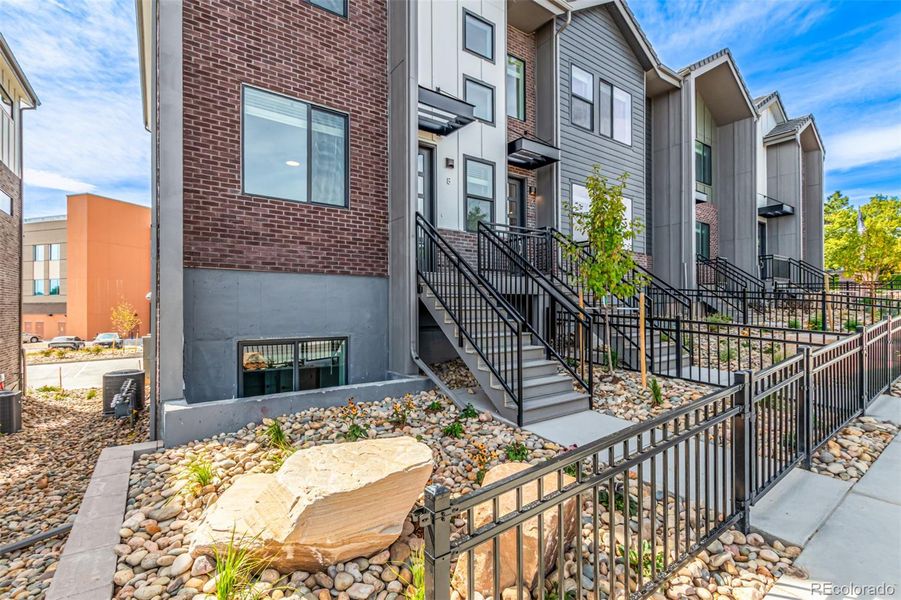 Exterior details and patio area of a home in Ascent at Inverness, Englewood (Image 1).