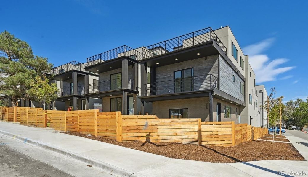 Brand new, front-back duplex buildings at the end of Tennyson across from open space