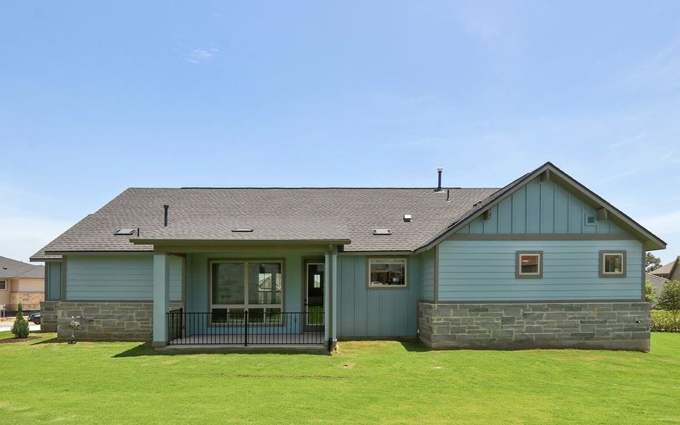 Front exterior of a new home in Cottage at Kissing Tree, San Marcos, TX, highlighting curb appeal (Image 2). Front exterior of a new home in Cottage at Kissing Tree, San Marcos, TX, highlighting curb appeal (Image 2).