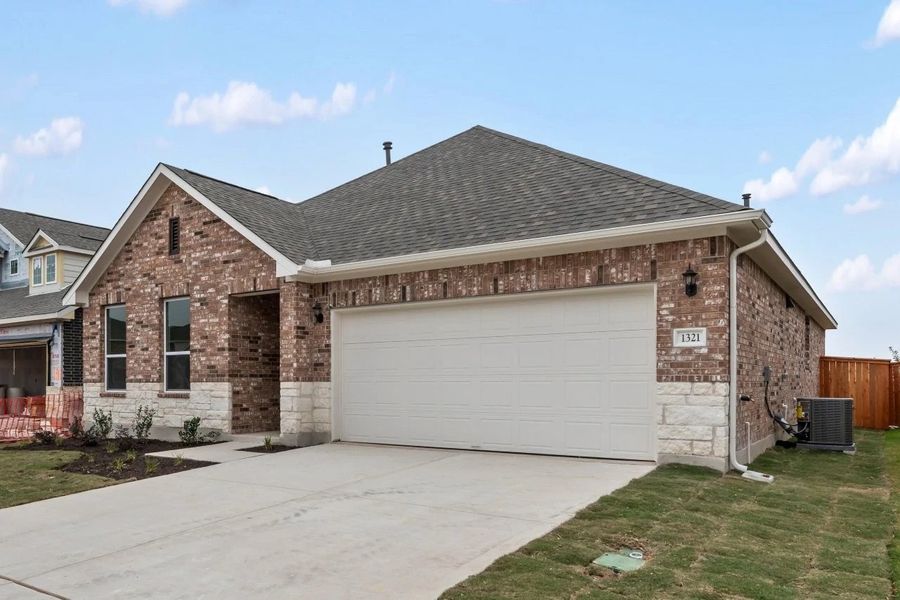 Front exterior of a new home in Berry Creek Highlands, Georgetown, TX, highlighting curb appeal (Image 24).