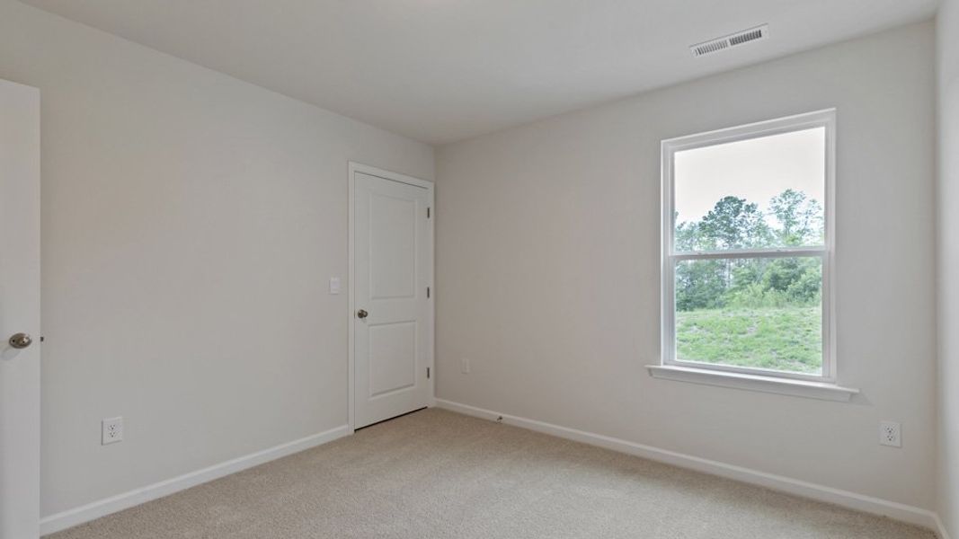 Spacious, unfurnished interior of a new home in The Grove at Matthews Landing, Fuquay Varina (Image 24).