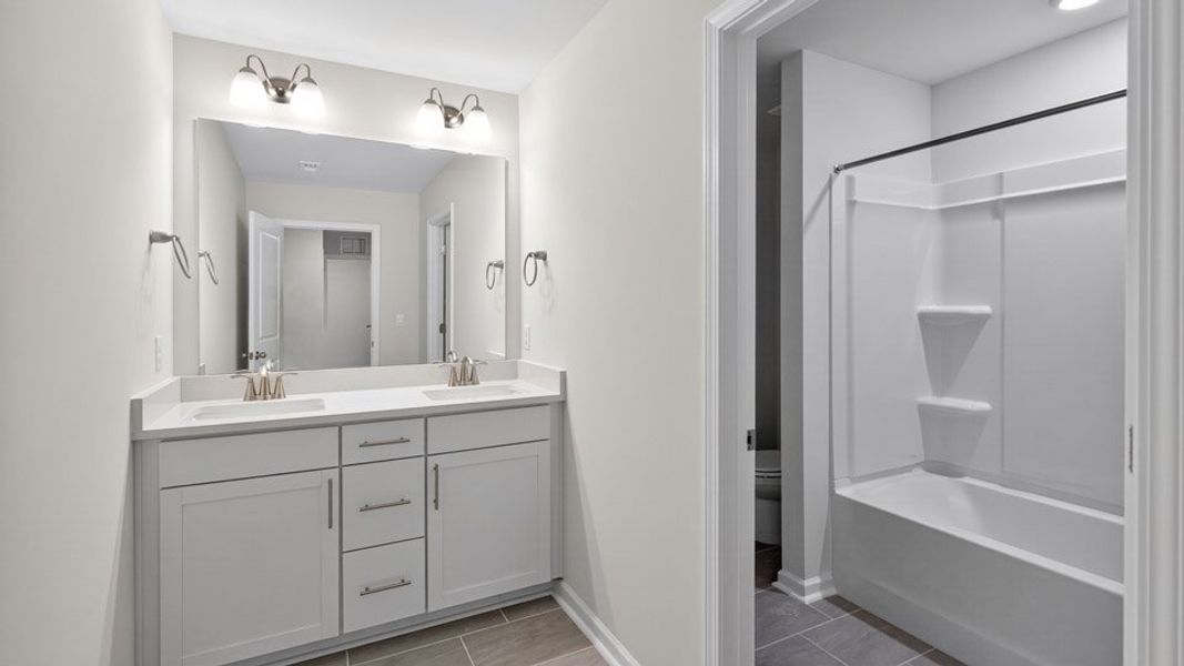 Representative furnished interior of a home built from the LAWSON by D.R. Horton in Horton Park, Apex (Image 8).