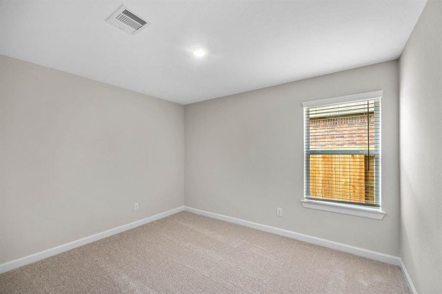 The secondary bedrooms are both of generous size and feature large closets.