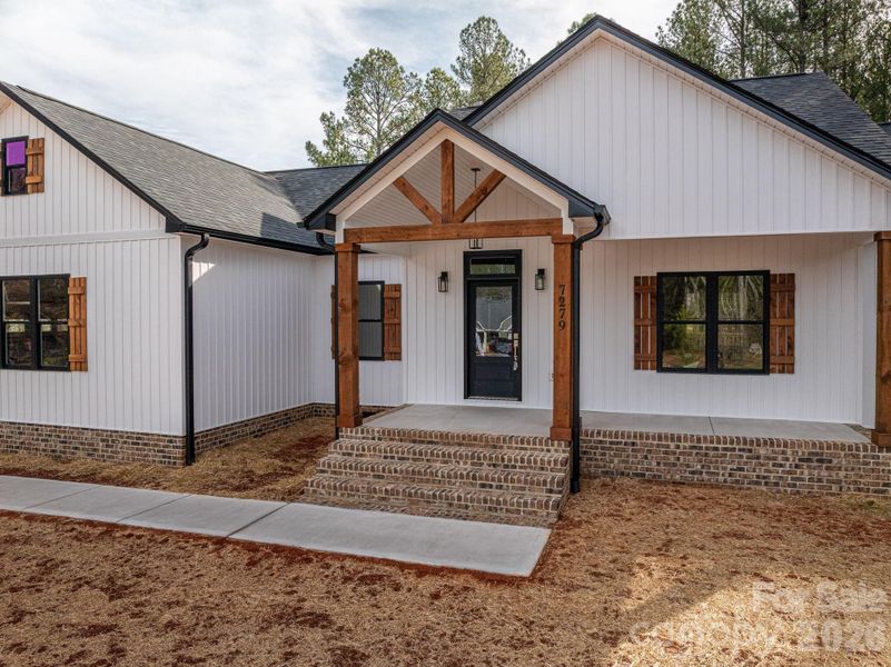 Front exterior of a new home in , Vale, NC, highlighting curb appeal (Image 14).