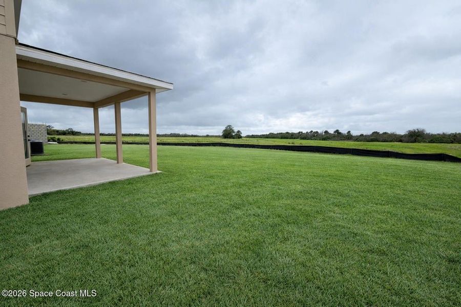 Exterior details and patio area of a home in St. John's Preserve, Palm Bay (Image 3).