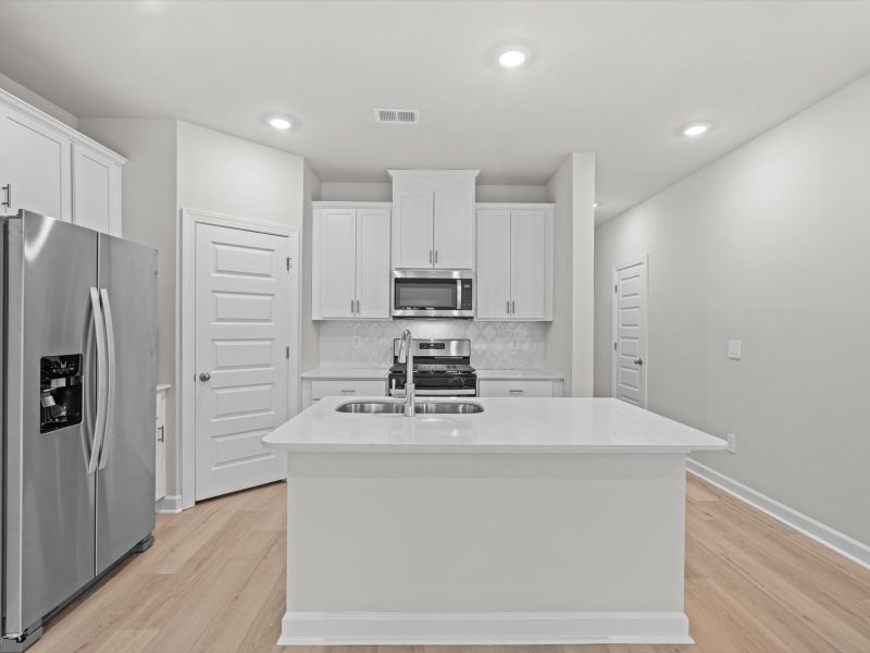 Furnished interior view inside a new home in Crossing at Abner Creek Townes, Greer (Image 3).