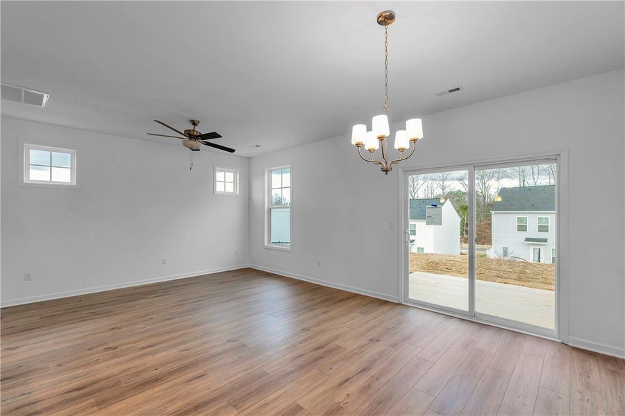 This bright space features a chandelier, large win This bright space features a chandelier, large win