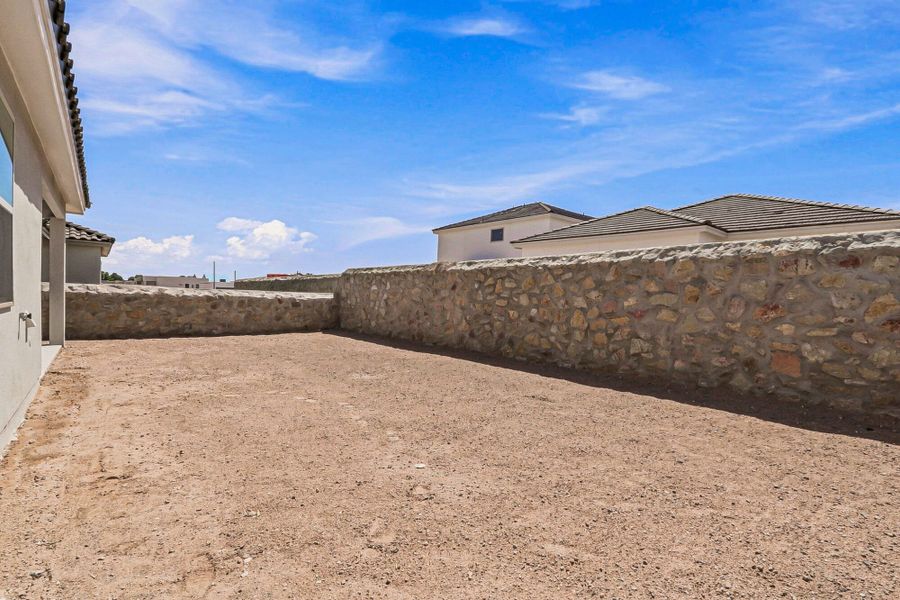 Exterior details and patio area of a home in Paseos Del Este, El Paso (Image 32).