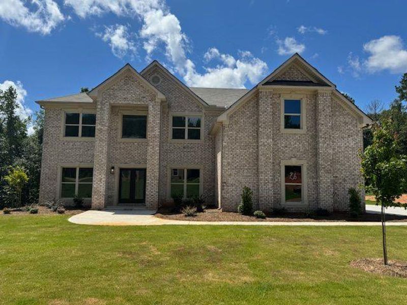 Front exterior of a new home in Underwood Crossing, Covington, GA, highlighting curb appeal (Image 14).