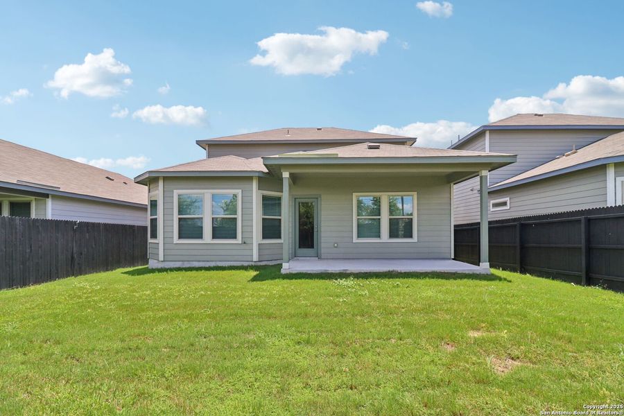 Front exterior of a new home in Remington Ranch, San Antonio, TX, highlighting curb appeal (Image 21). Front exterior of a new home in Remington Ranch, San Antonio, TX, highlighting curb appeal (Image 21).