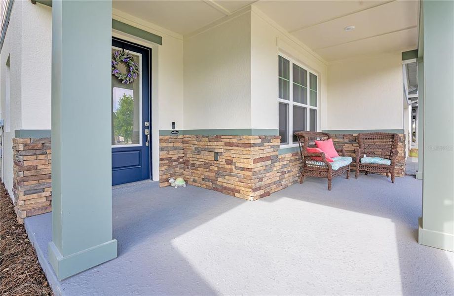 Exterior details and patio area of a home in Oakfield at Mount Dora Village Series, Mount Dora (Image 29).