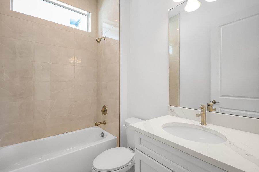 Furnished interior view inside a new home in Rivella, Port St. Lucie (Image 12).