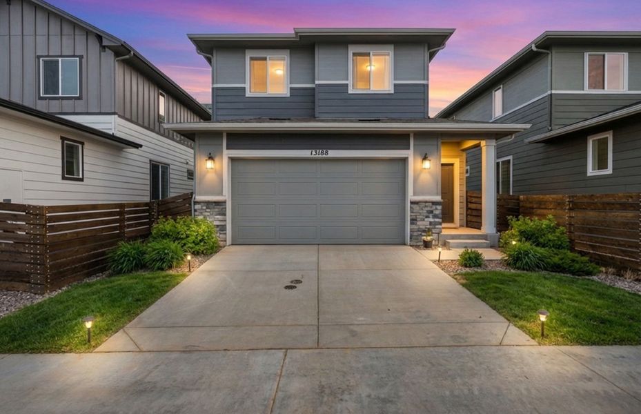 Front exterior of a new home in Barefoot Village, Firestone, CO, highlighting curb appeal (Image 1). Front exterior of a new home in Barefoot Village, Firestone, CO, highlighting curb appeal (Image 1).