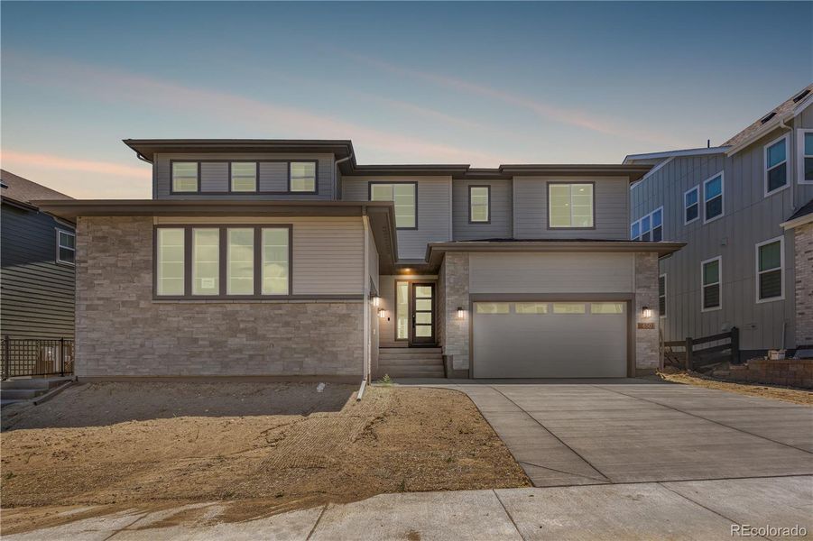 Front exterior of a new home in Luxe at The Canyons, Castle Pines, CO, highlighting curb appeal (Image 26).