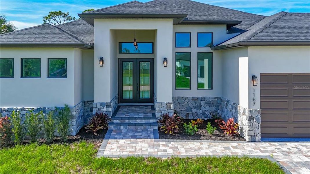 Front exterior of a new home in , Rotonda West, FL, highlighting curb appeal (Image 1). Front exterior of a new home in , Rotonda West, FL, highlighting curb appeal (Image 1).