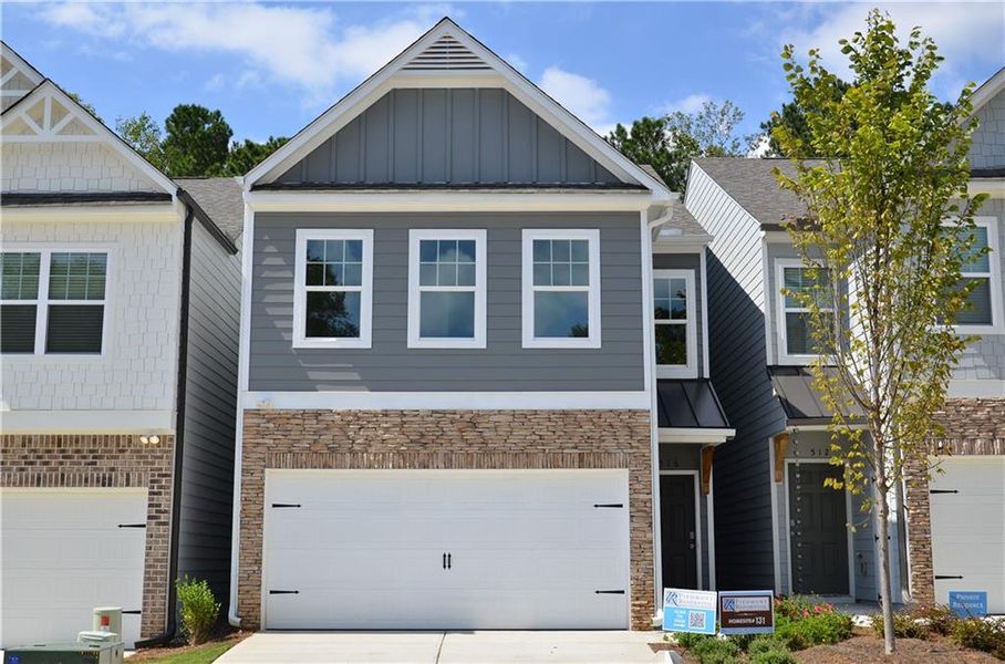 Front exterior of a new home in Owen Preserve, Canton, GA, highlighting curb appeal (Image 1). Front exterior of a new home in Owen Preserve, Canton, GA, highlighting curb appeal (Image 1).