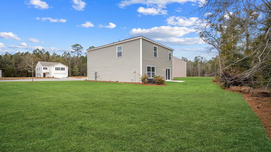 Exterior details and patio area of a home in Longleaf Village, Rincon (Image 3).