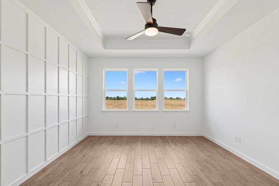 Spacious primary suite with decorative feature wall Spacious primary suite with decorative feature wall