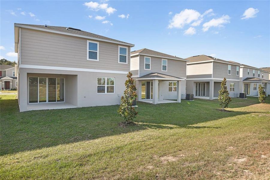 Exterior details and patio area of a home in Seasons at Aurora Oaks, Ocala (Image 14).