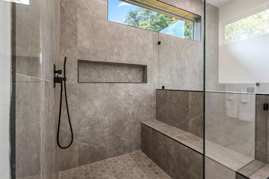 Bathroom featuring a tile shower