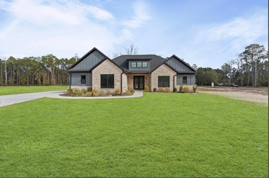 Front exterior of a new home in , Conroe, TX, highlighting curb appeal (Image 27).